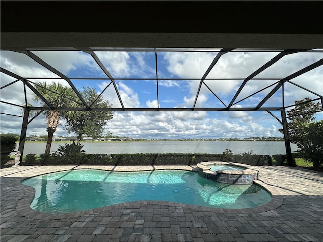 7760 Grande Shores Dr, Sarasota, FL 34240 - view of pool featuring a water view, a patio, glass enclosure, and a pool with connected hot tub