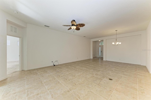 empty room featuring light tile patterned floors, ceiling fan with notable chandelier, and visible vents