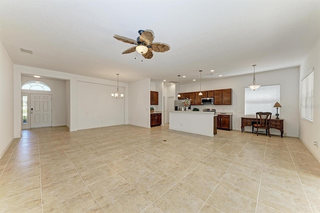 unfurnished living room featuring recessed lighting, visible vents, light tile patterned floors, and ceiling fan with notable chandelier