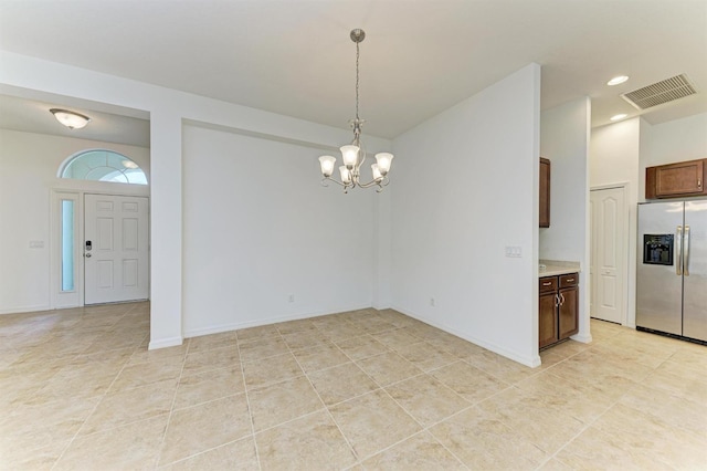 unfurnished dining area featuring baseboards, visible vents, an inviting chandelier, recessed lighting, and vaulted ceiling