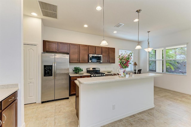 kitchen with visible vents, stainless steel appliances, and light countertops