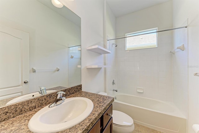 full bath with vanity, tile patterned floors, toilet, and washtub / shower combination