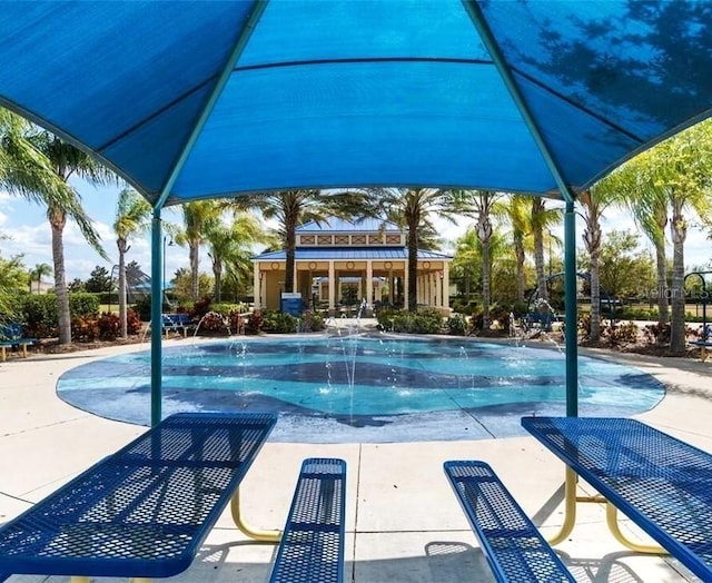 community pool featuring a patio area