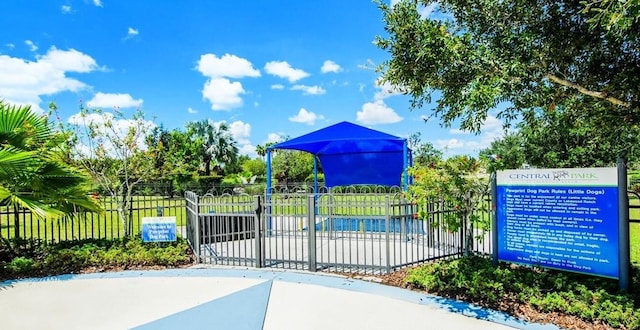 view of gate with fence