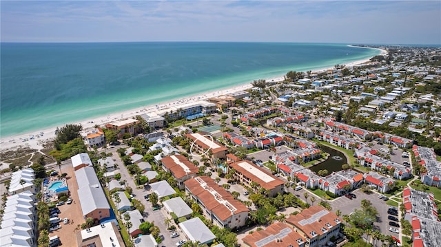 bird's eye view with a beach view and a water view