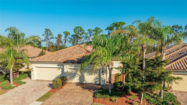 mediterranean / spanish-style house featuring a garage