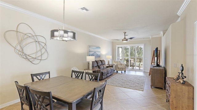 dining space featuring crown molding, ceiling fan, and light tile patterned floors