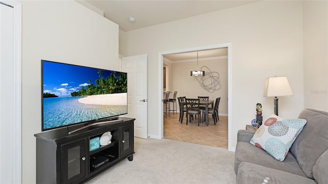 living room with crown molding and light colored carpet