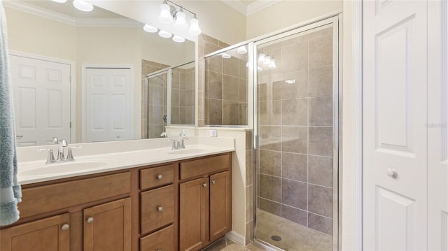 bathroom featuring vanity, crown molding, and a shower with shower door