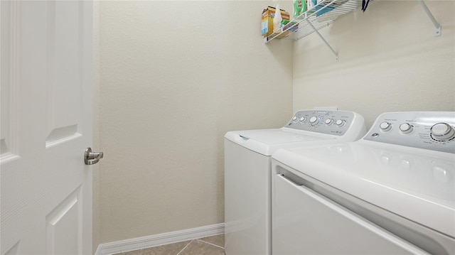 washroom featuring light tile patterned flooring and separate washer and dryer