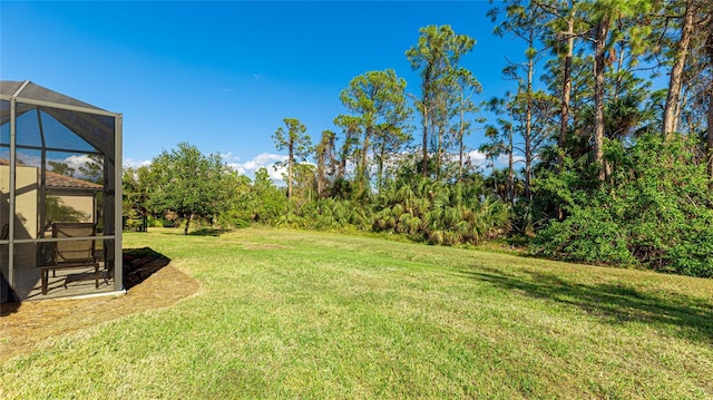 view of yard featuring a lanai