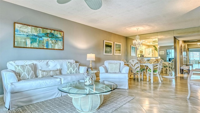 living room with a textured ceiling and a chandelier