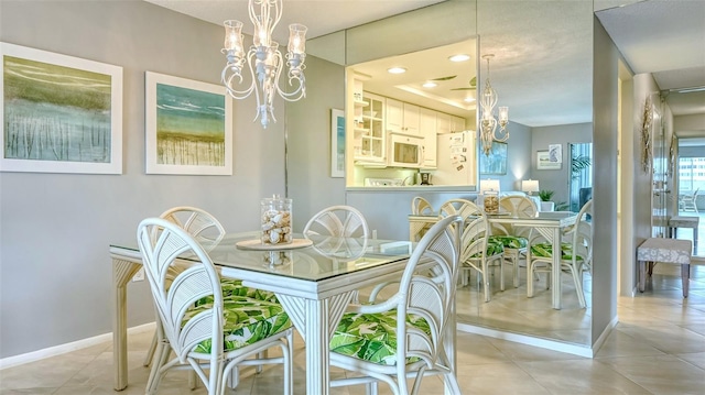 dining room with an inviting chandelier and light tile patterned flooring