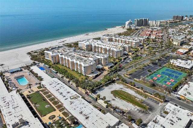 aerial view with a water view and a beach view