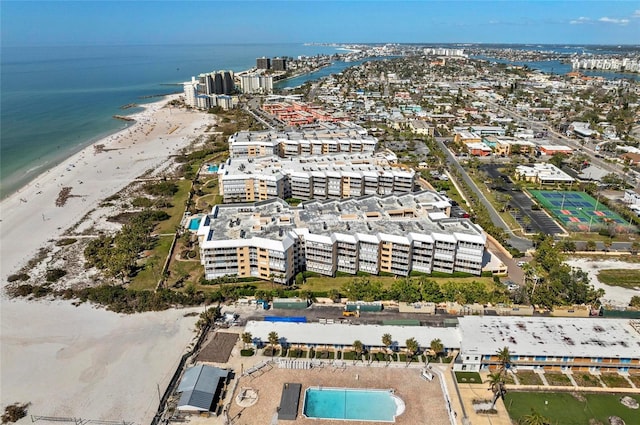 aerial view featuring a water view and a beach view