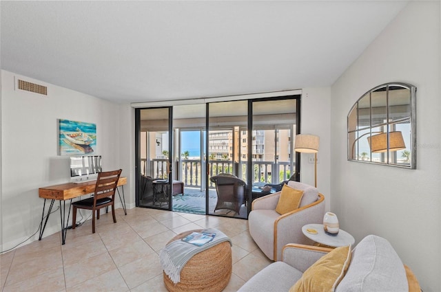 tiled living room with expansive windows