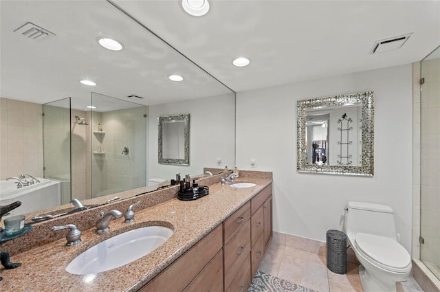 bathroom featuring tile patterned flooring, vanity, an enclosed shower, and toilet