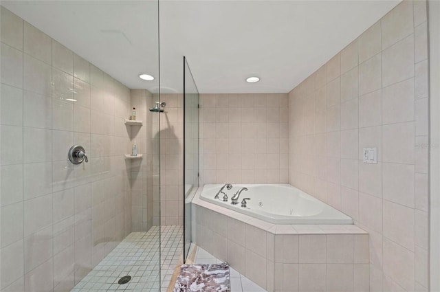 bathroom with plus walk in shower and tile walls