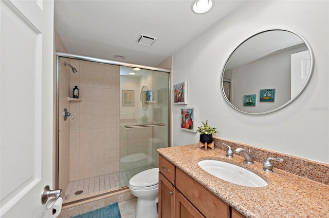 bathroom with an enclosed shower, vanity, tile patterned flooring, and toilet