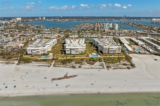 birds eye view of property with a view of the beach and a water view