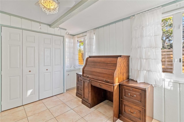 2375 Riverwood Pines Dr, Sarasota, FL 34231 - misc room with beamed ceiling and light tile patterned floors