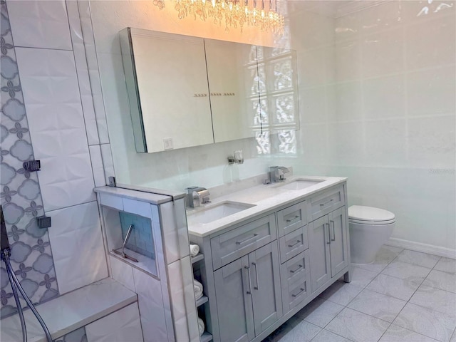 2375 Riverwood Pines Dr, Sarasota, FL 34231 - bathroom featuring vanity, toilet, and tile walls