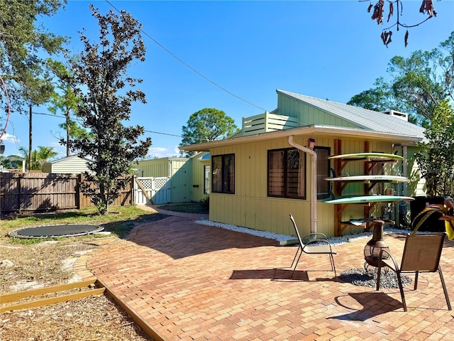 2375 Riverwood Pines Dr, Sarasota, FL 34231 - exterior space with a patio and a trampoline