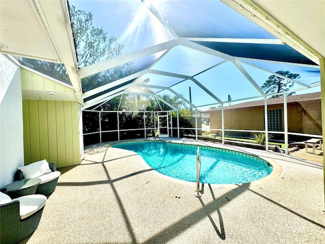 2375 Riverwood Pines Dr, Sarasota, FL 34231 - view of swimming pool featuring a patio and glass enclosure