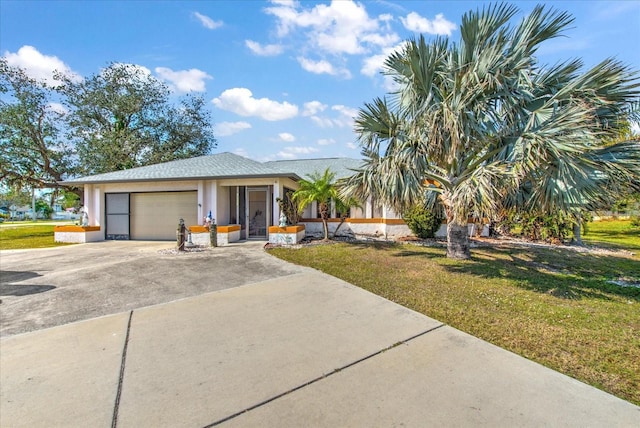 view of front of property featuring a garage and a front lawn