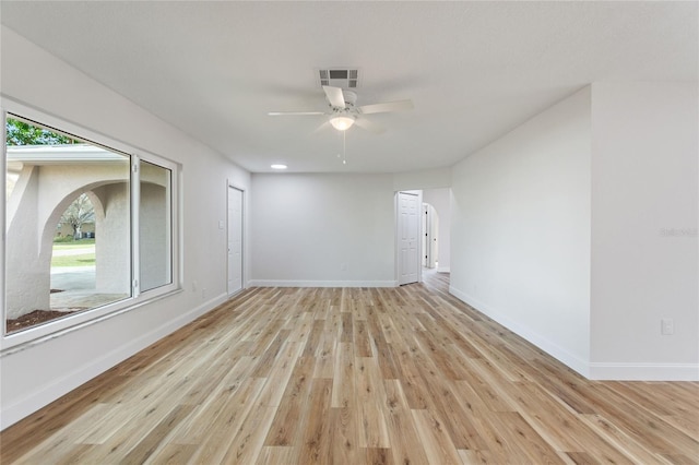 empty room with ceiling fan and light wood-type flooring