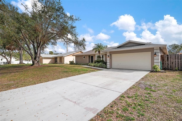 ranch-style house featuring a garage and a front lawn