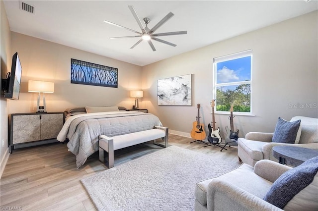 bedroom with ceiling fan and wood-type flooring