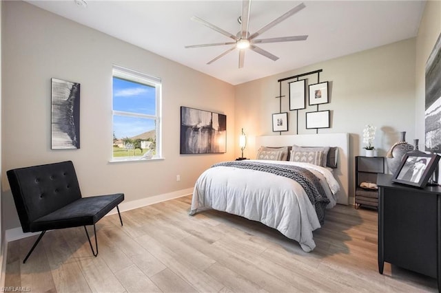 bedroom featuring ceiling fan and light hardwood / wood-style floors