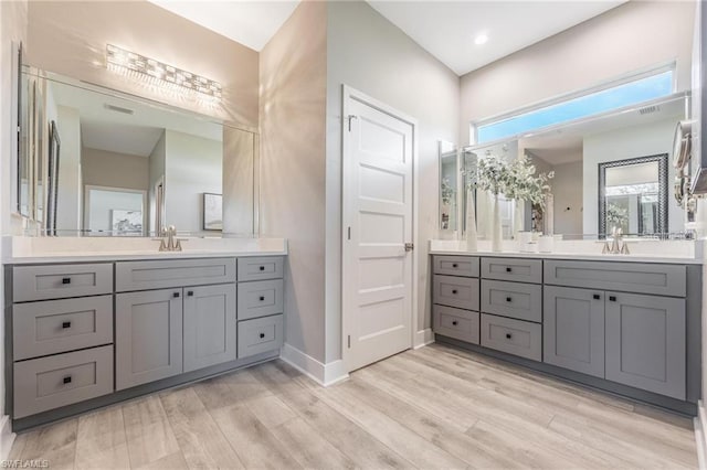 bathroom featuring vanity and hardwood / wood-style floors