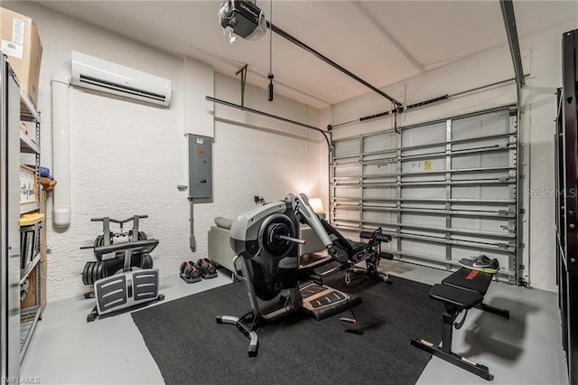 workout room featuring a wall unit AC and electric panel