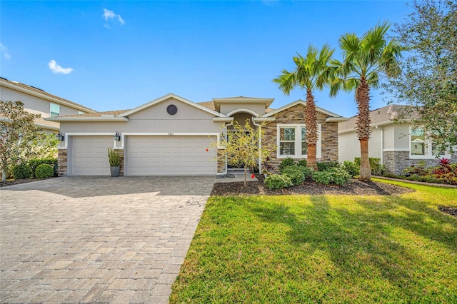 view of front of property featuring a garage and a front lawn