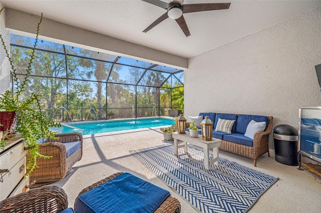 view of swimming pool with a lanai, an outdoor hangout area, a patio, and ceiling fan