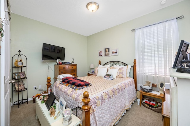 bedroom featuring light carpet