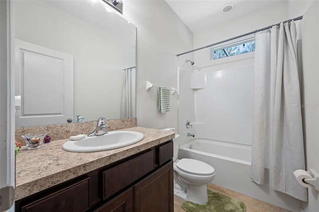 full bathroom featuring vanity, tile patterned floors, toilet, and shower / bath combo with shower curtain