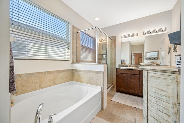 5821 Hevena Ct, Palmetto, FL 34221 - full bath featuring a bath, vanity, a stall shower, and tile patterned floors