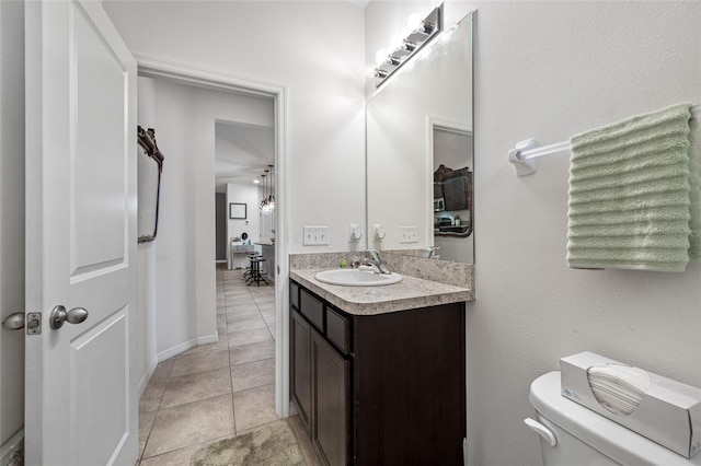 5821 Hevena Ct, Palmetto, FL 34221 - half bathroom featuring vanity, toilet, tile patterned floors, and baseboards