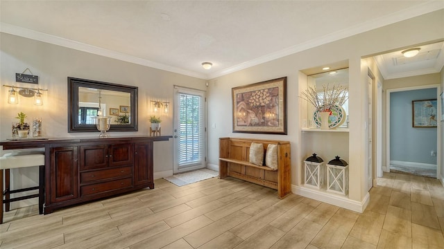 living area with crown molding and light wood-type flooring