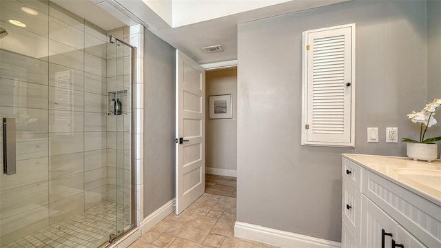 bathroom featuring vanity and a shower with door