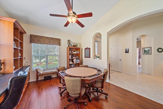 dining area with hardwood / wood-style floors and ceiling fan