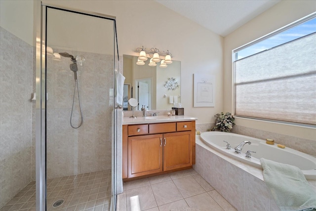 bathroom featuring vanity, tile patterned floors, shower with separate bathtub, and lofted ceiling