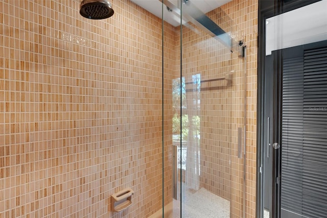 bathroom with tile walls and walk in shower