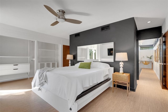 bedroom featuring multiple windows and ceiling fan