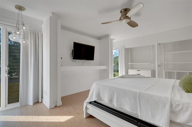 bedroom with ceiling fan and light hardwood / wood-style flooring