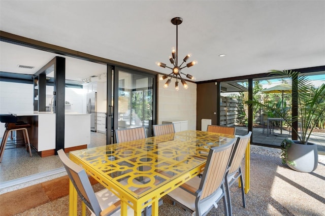 dining area with a notable chandelier