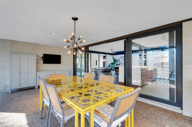 dining space featuring an inviting chandelier